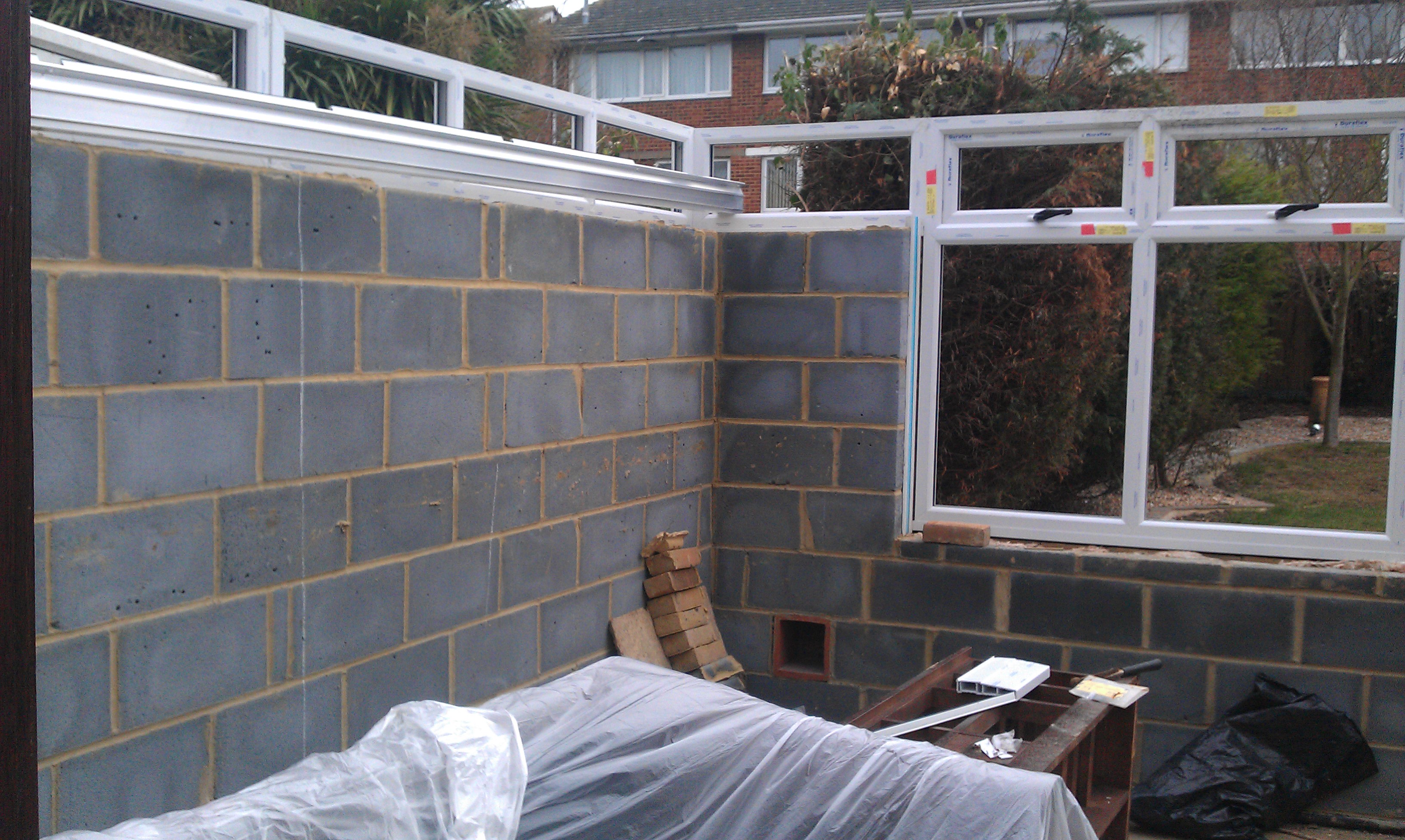 Block walls and no roof. Will this conservatory ever be ready for painting.