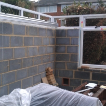 Block walls and no roof. Will this conservatory ever be ready for painting.
